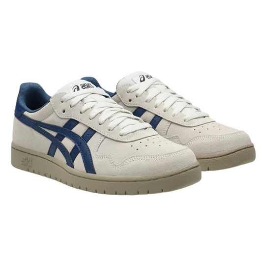 White sneakers with blue accents on a white background