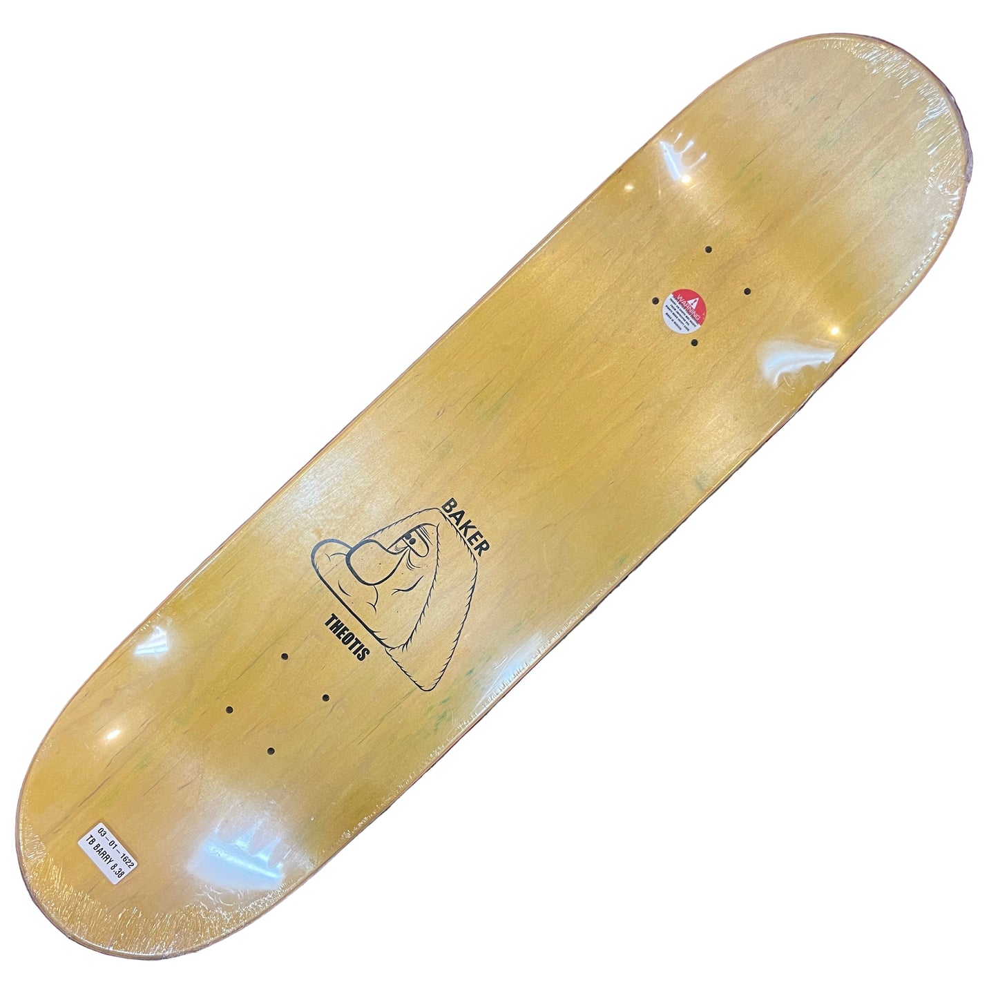 Wooden skateboard deck with a logo on a red and gray patterned surface
