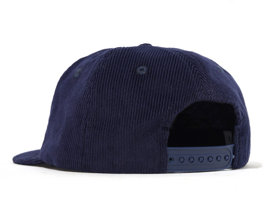 Navy blue cap with a textured surface on a white background