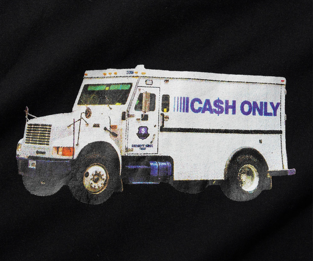 White armored vehicle with 'Cash Only' text on a black background