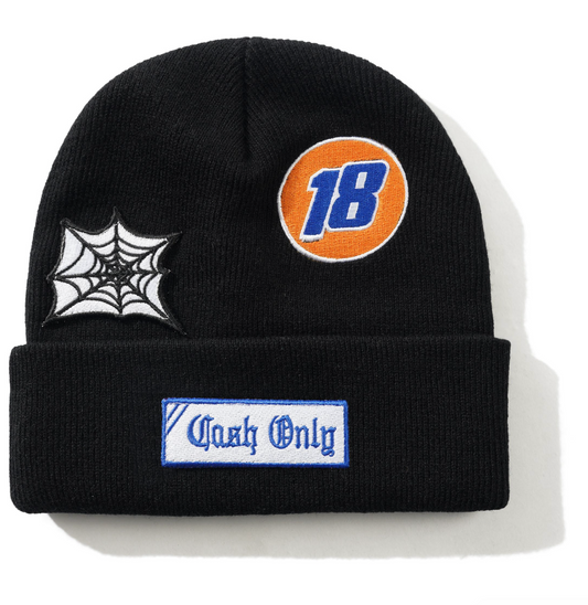 Black beanie with spider web, number 18, and 'Cash Only' patches on a white background