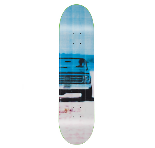 Skateboard deck with a truck graphic on a white background
