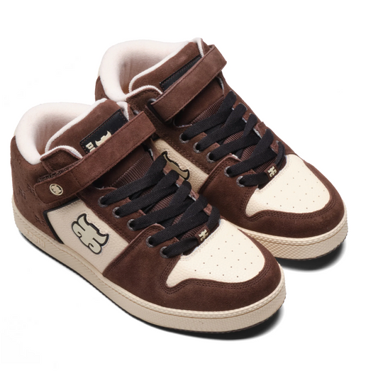Brown and white sneakers with black velcro straps on a white background