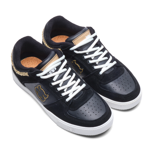 Black sneakers with white laces on a white background