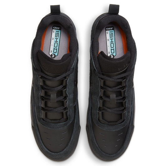 Pair of black sneakers on a white background