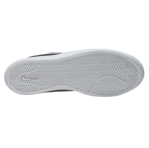The white textured outsole of a Nike sneaker, showing the herringbone tread pattern and a subtle embossed Nike Swoosh on the heel
