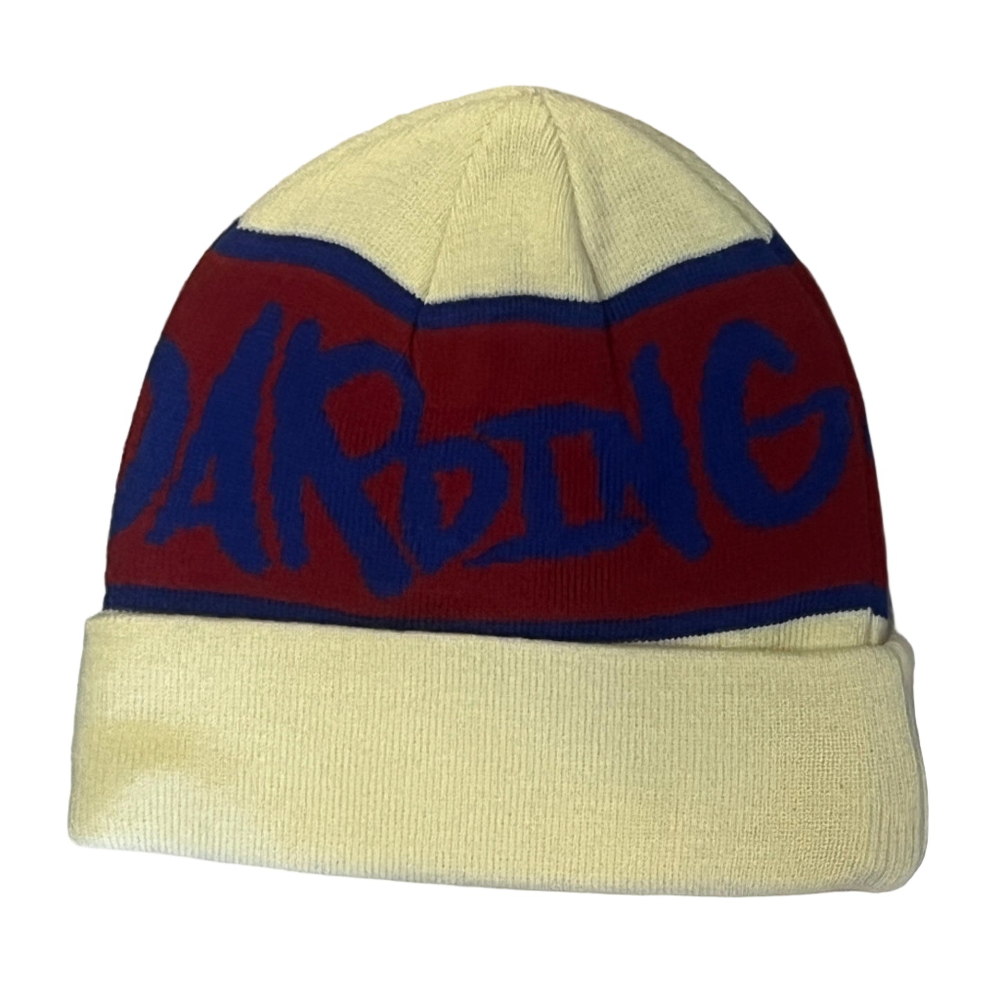 Beige and red beanie with blue text on a wooden surface