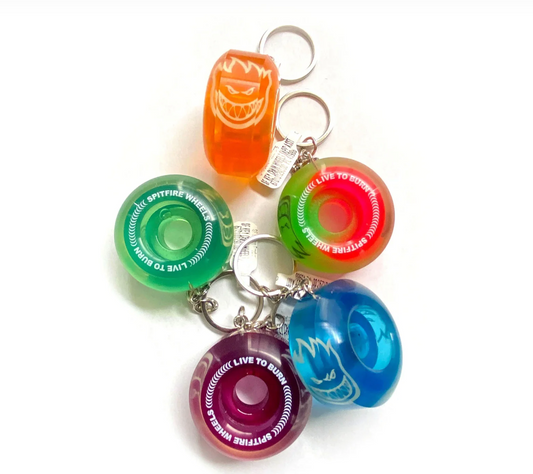 Colorful keychain with various shaped keychains on a white background