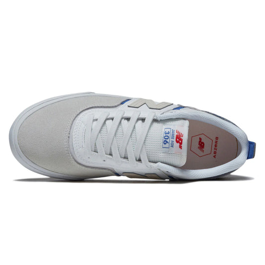 White sneaker with blue accents on a white background
