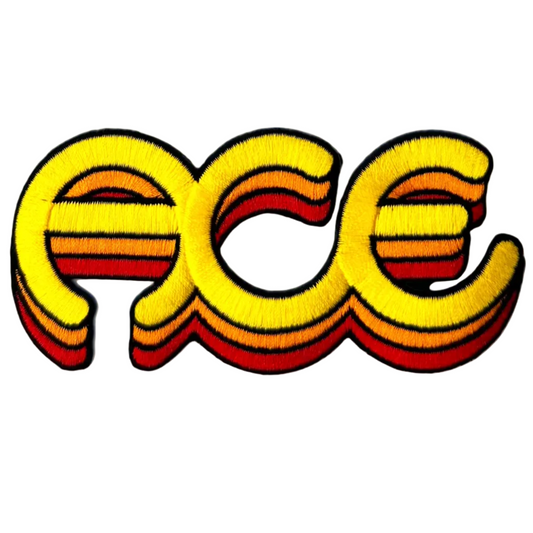 Embroidered patch with 'PCE' design on a white background