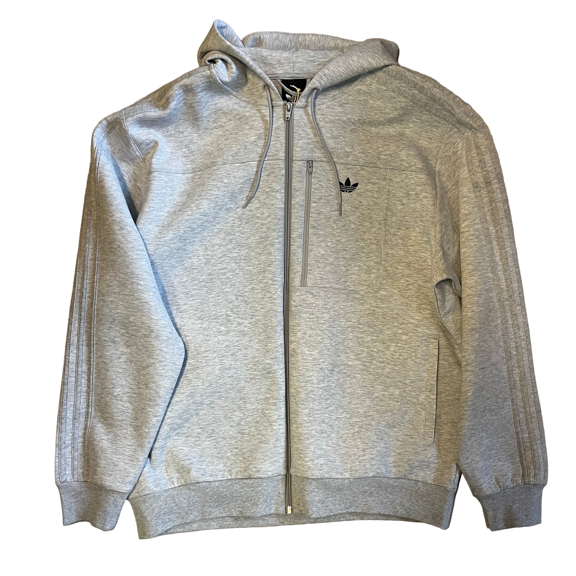 Gray hoodie with a brand logo on a wooden floor