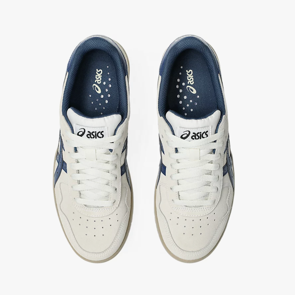 Pair of white sneakers with blue accents on a white background