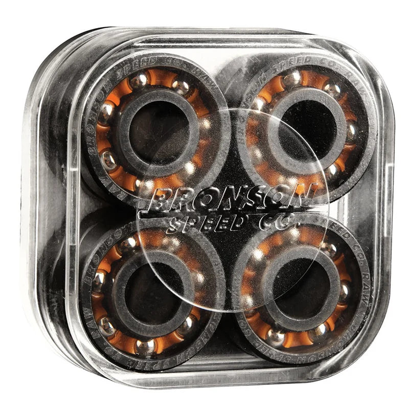Four skateboard bearings in a clear container with Bronson Speed Co branding.