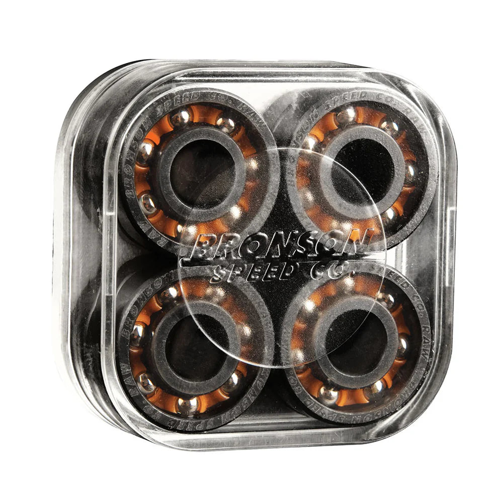 Four skateboard bearings in a clear plastic container with Bronson Speed Co branding.