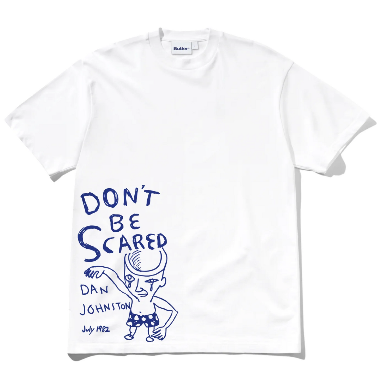 White t-shirt with blue graphic and text 'Don't Be Scared' by Dan Johnston on a white background