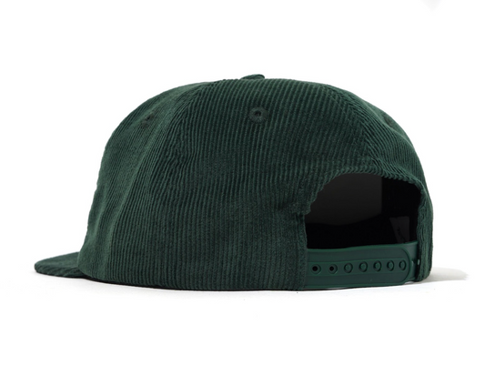 Green corduroy cap on a white background