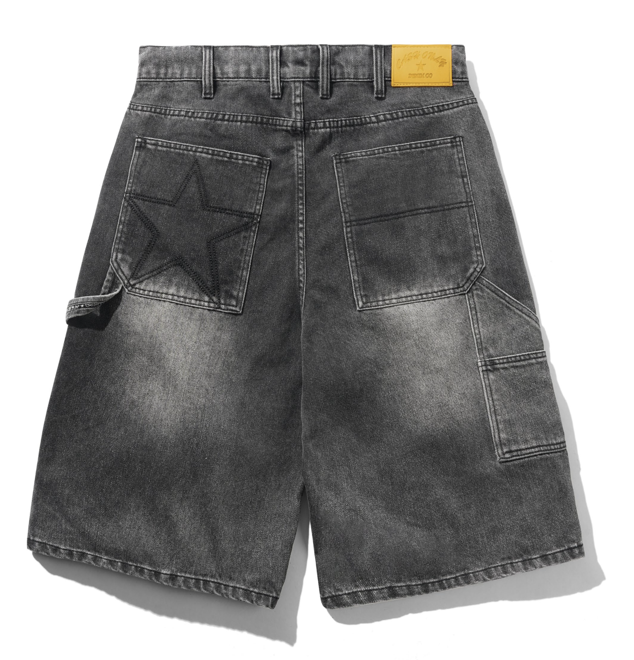 Black denim shorts with star pocket design on a white background