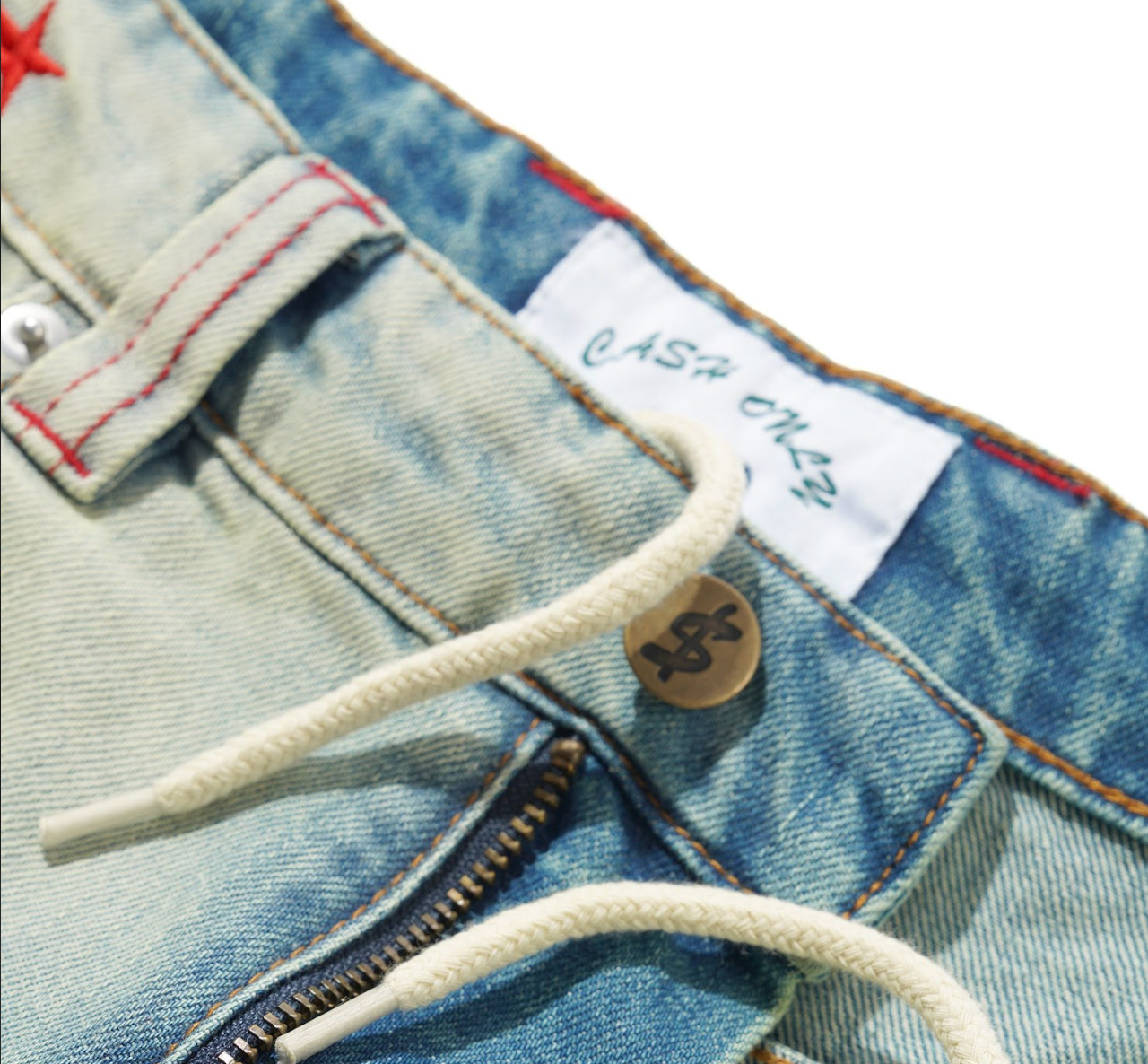 Close-up of a blue denim jacket with a brand label and buttons.