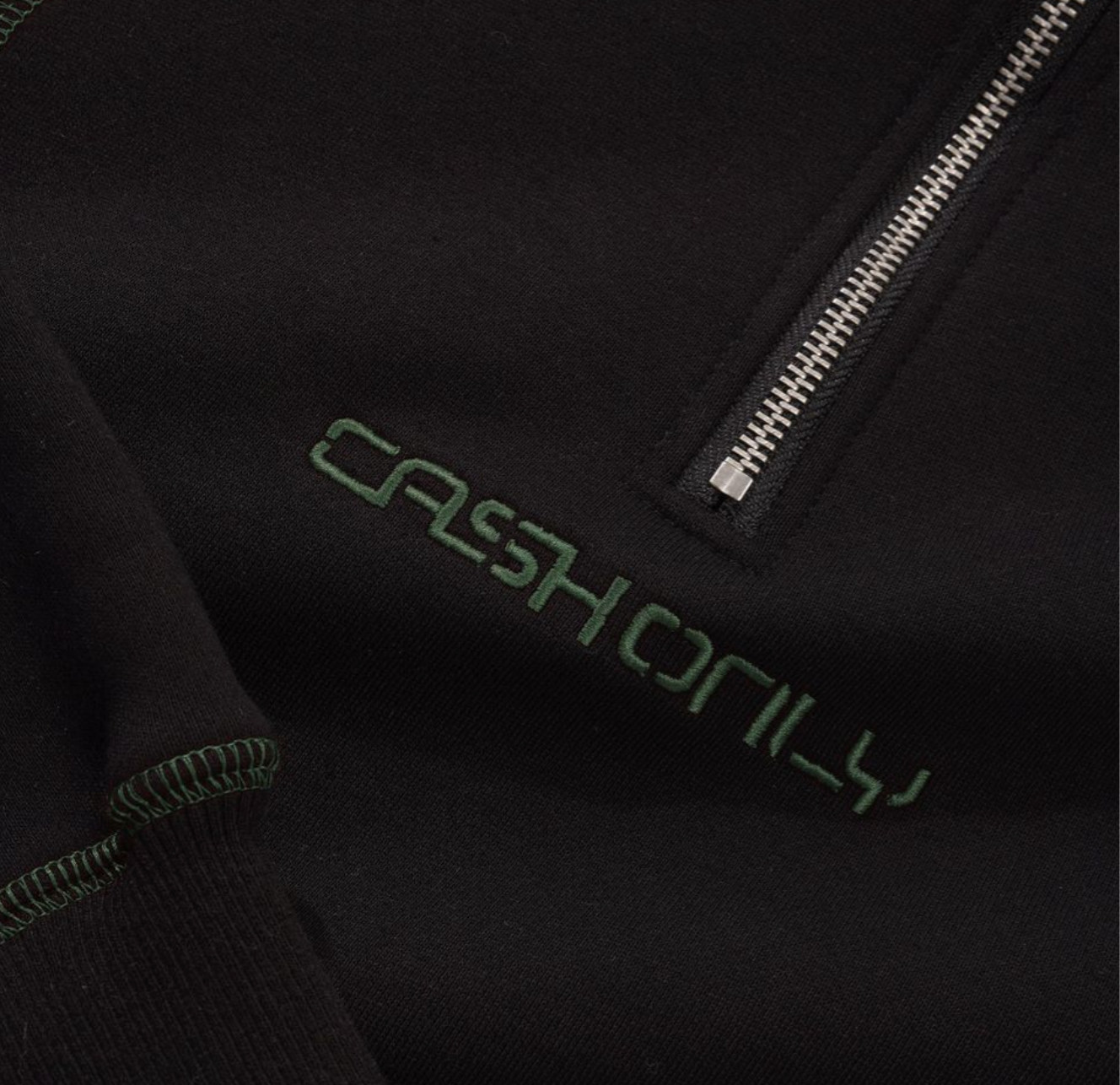 Black jacket with 'Cash Only' text embroidered on the chest.