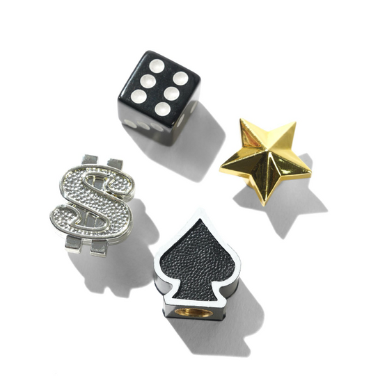 Decorative items including a dice, star, and playing card symbols on a white background