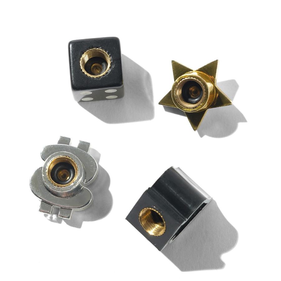 Four metal components with gold and silver finishes on a white background