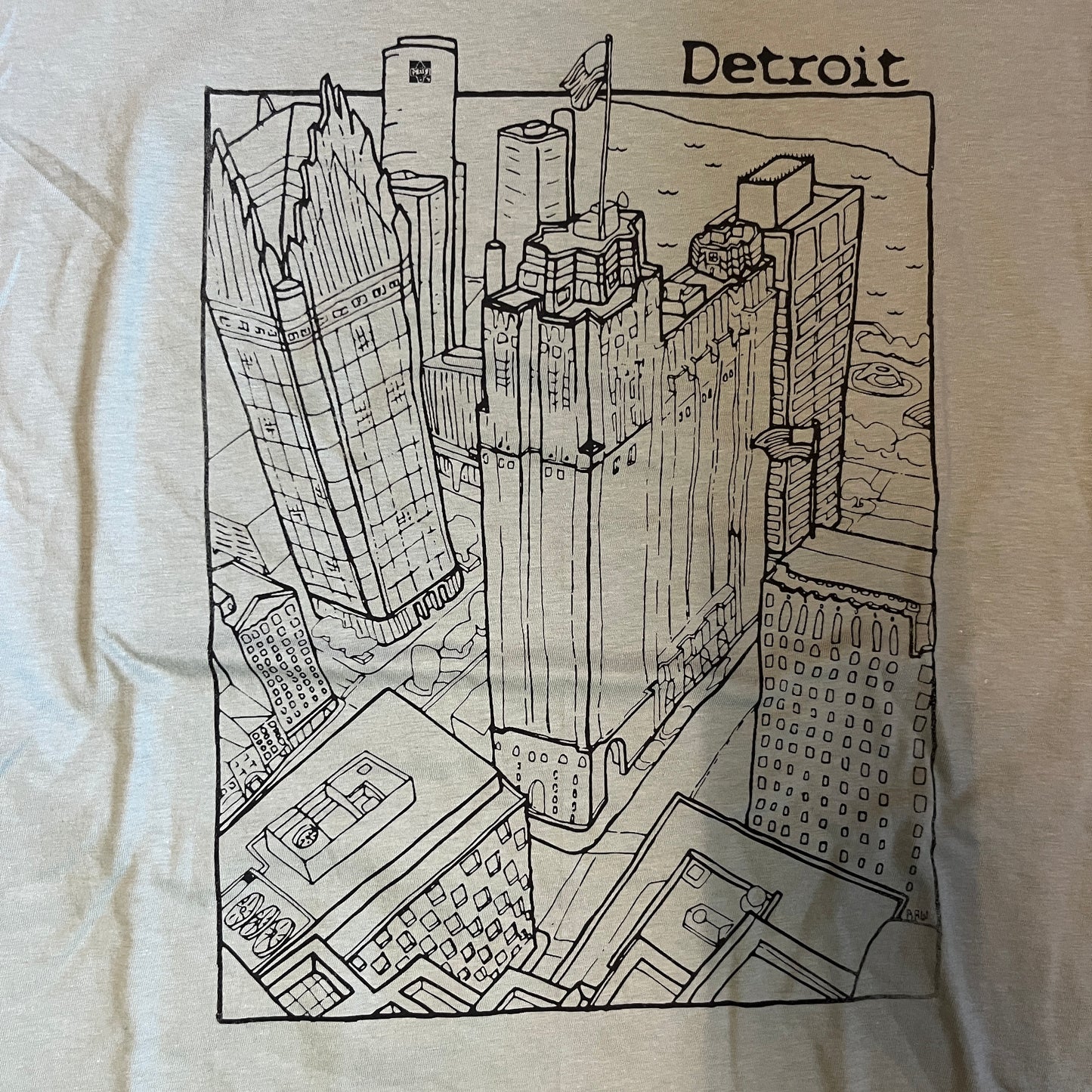 Sate green t-shirt with black line drawing of a cityscape labeled 'Detroit'.