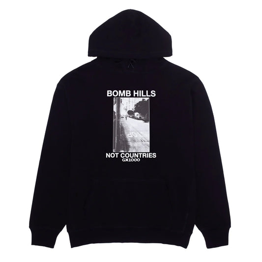 Black hoodie with 'Bomb Hills Not Countries' text and graphic on a white background