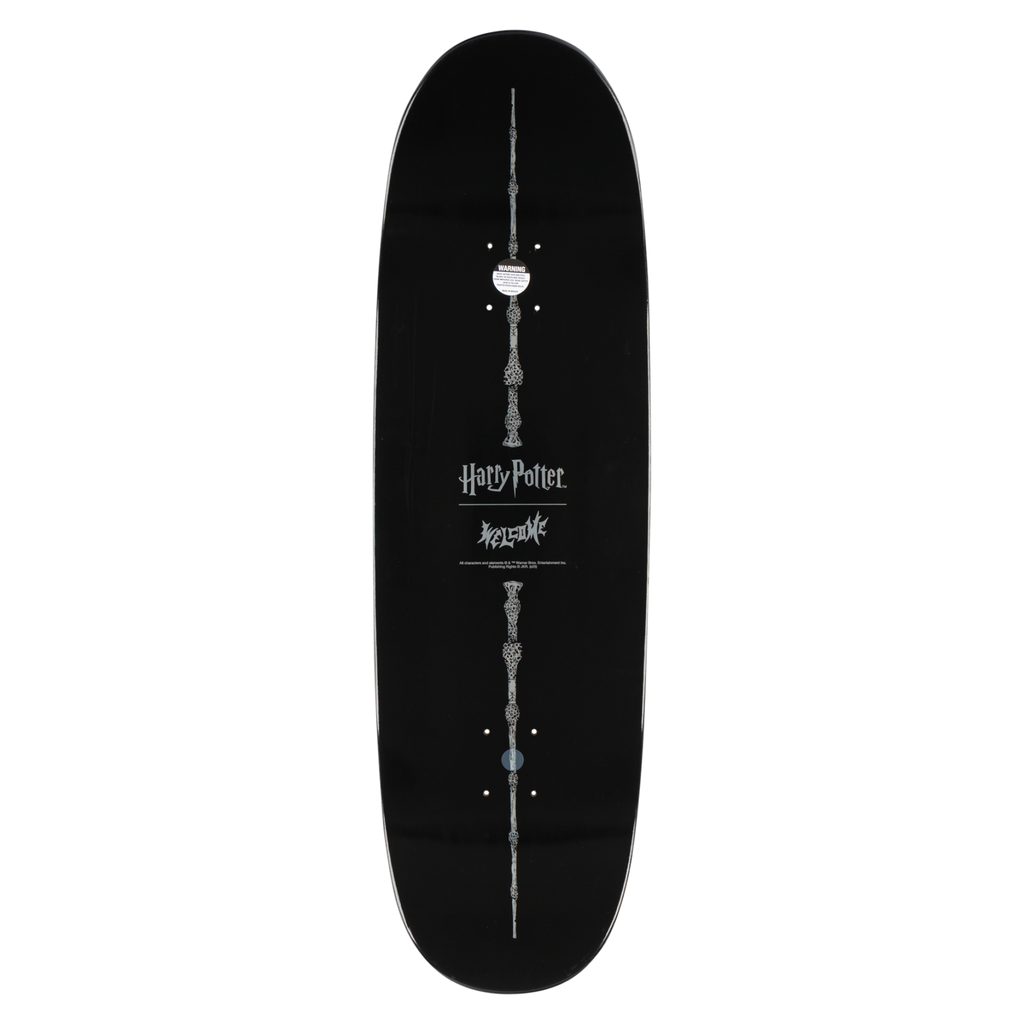 Black skateboard deck with 'Harry Potter' design on a white background
