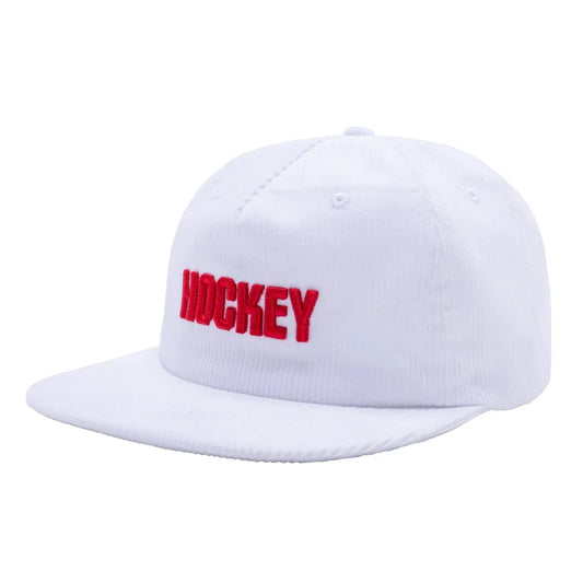 A white flat-brim baseball cap with the word 'HOCKEY' embroidered in red across the front, shown on a plain white background.