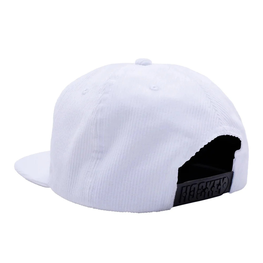 White corduroy snapback cap shown from the back, featuring a black adjustable strap with 'HASKETO' printed on it, set against a plain white background.