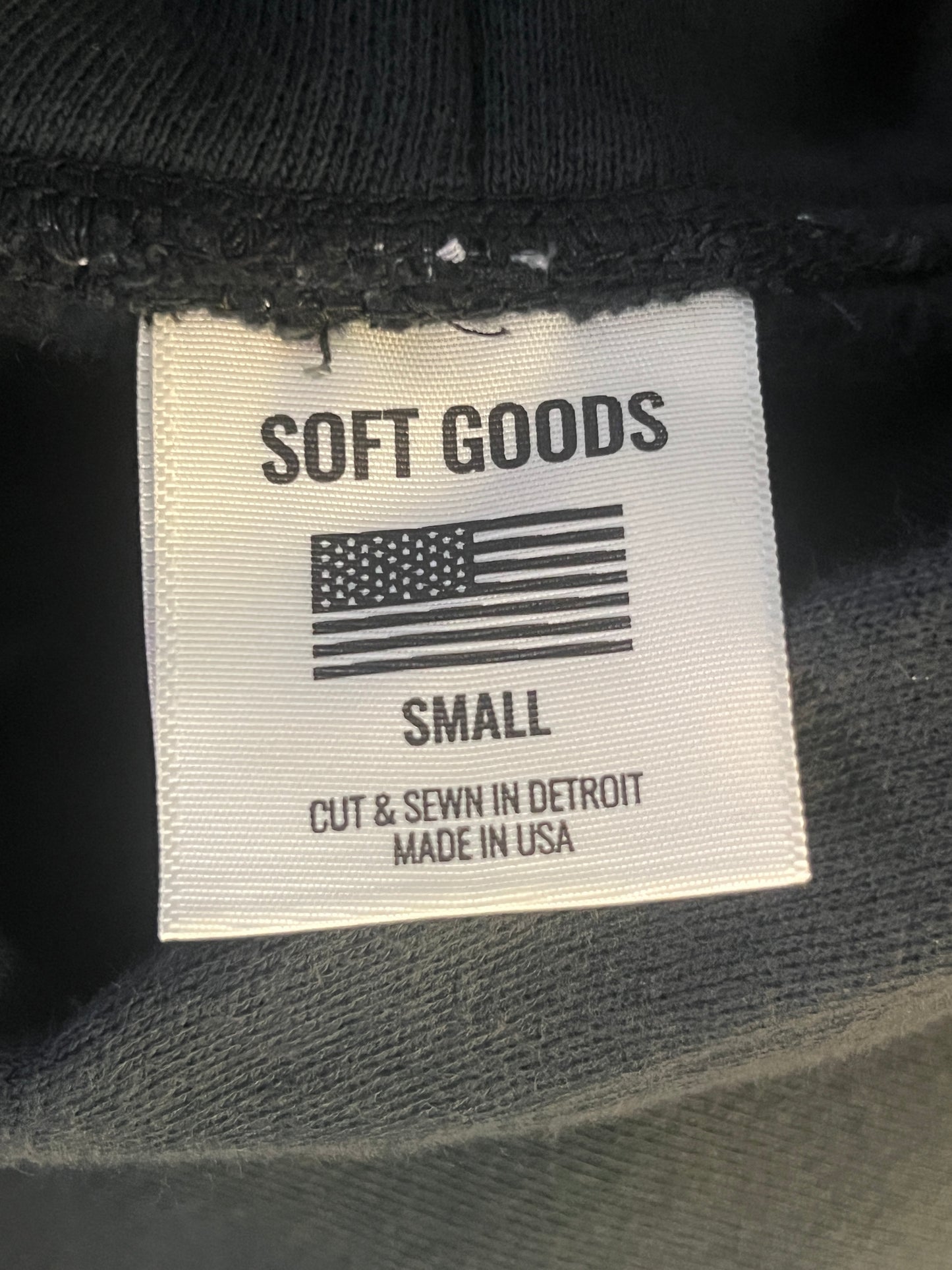 Soft Goods apparel tag with 'cut and sewn in detroit, made in usa' visable