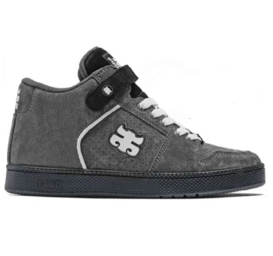 A dark gray suede high-top sneaker with a black strap closure, white laces, and a white stylized logo on the side