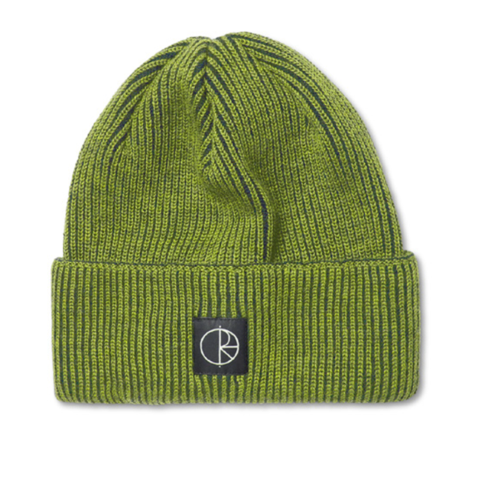 An olive green ribbed knit beanie hat with a black square patch on the front featuring a white stylized logo, set against a plain white background.