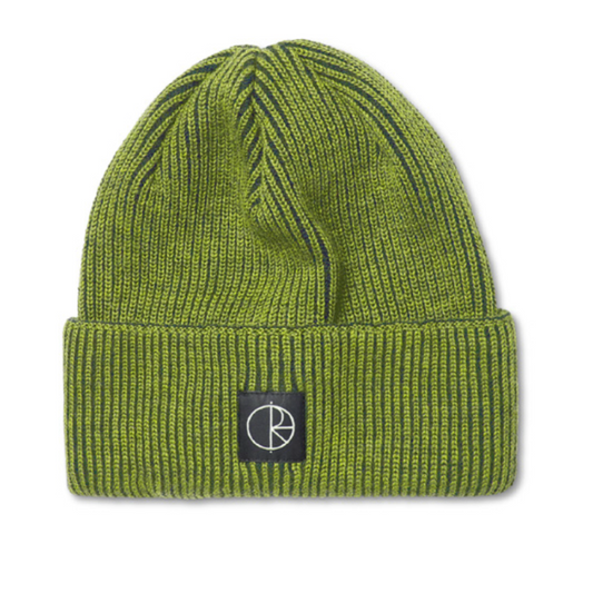 An olive green ribbed knit beanie hat with a black square patch on the front featuring a white stylized logo, set against a plain white background.