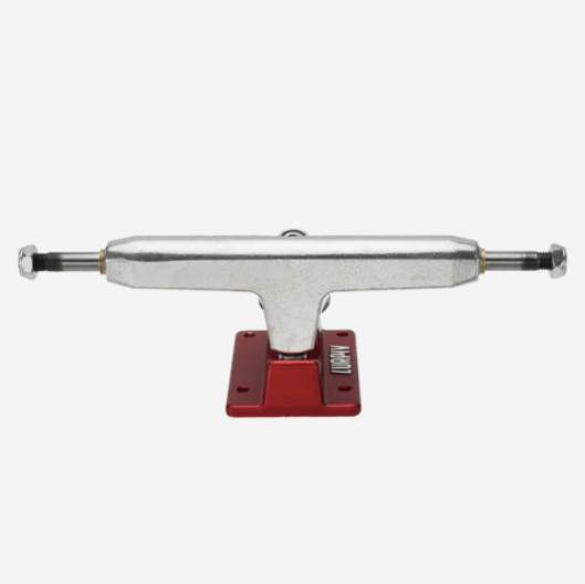 A skateboard truck with a silver metal chrome-finished body and a red anodized base plate