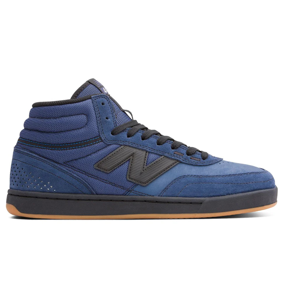 Blue high-top sneaker with black accents on a white background