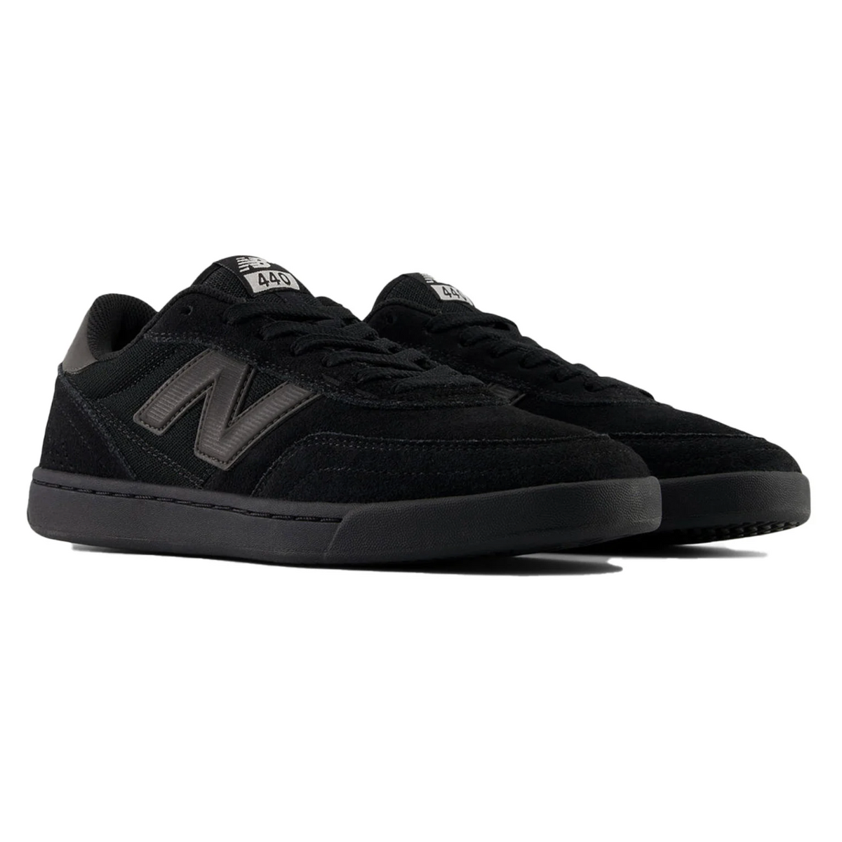 Black athletic shoes with Under Armour logo on a white background