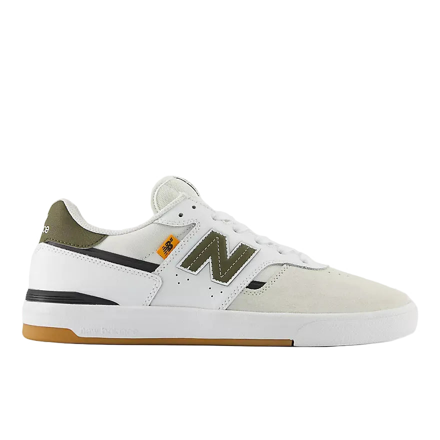 White sneaker with green accents on a white background