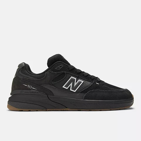Black sneaker with New Balance logo on a white background