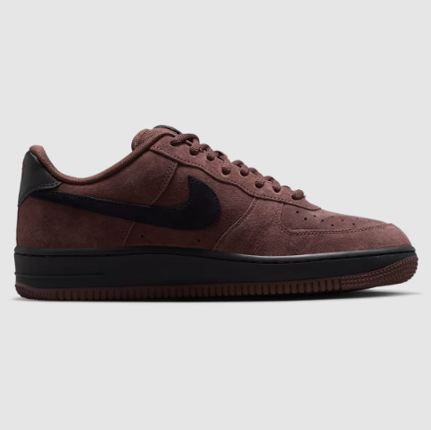 A single Nike Air Force 1 Low sneaker in a dark brown and black suede combination, shown in a side profile