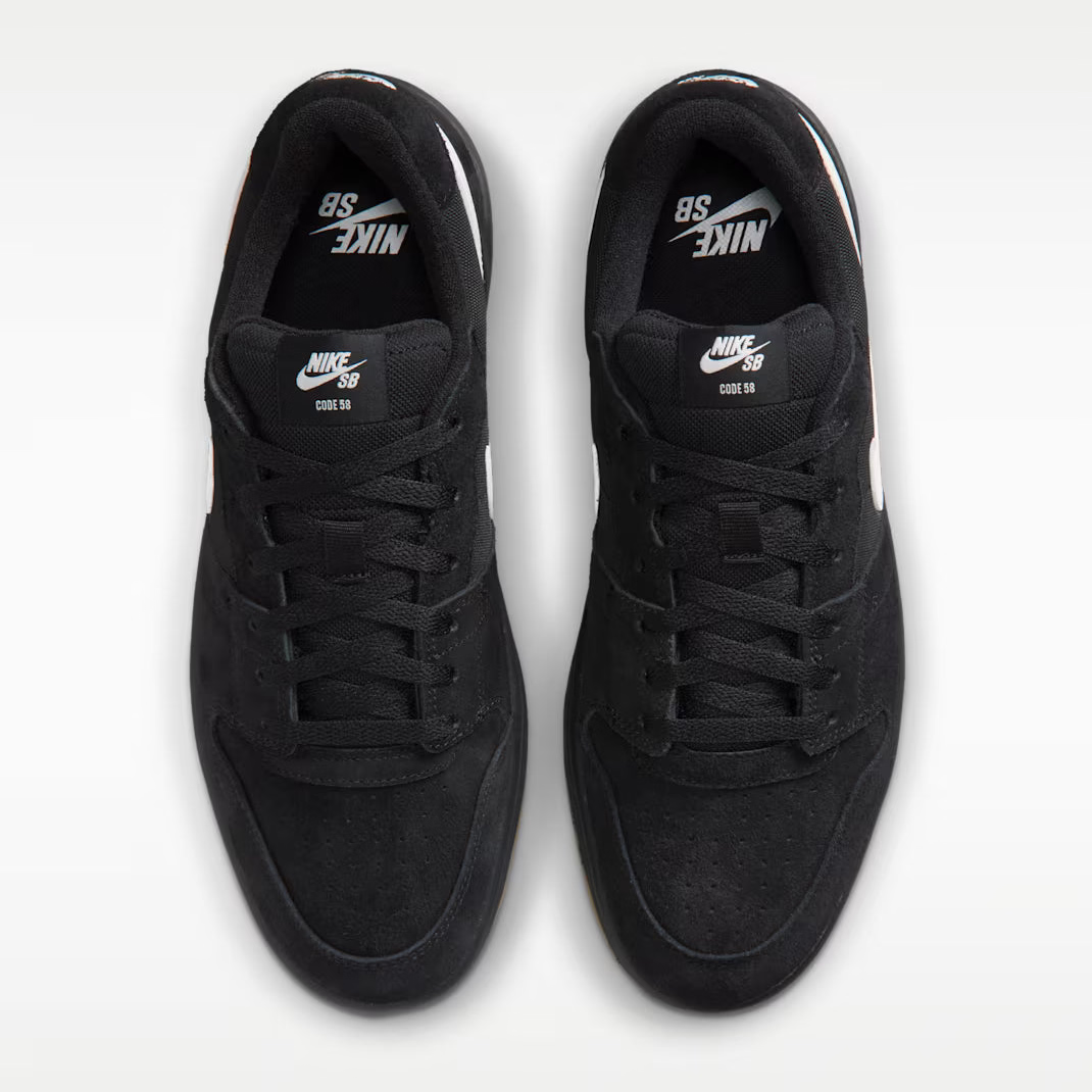A pair of black Nike SB 80th Anniversary sneakers shown from a top-down view on a light gray background.