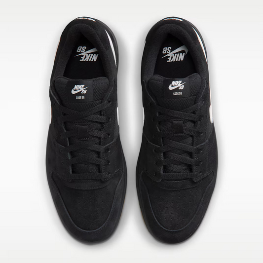 A pair of black Nike SB 80th Anniversary sneakers shown from a top-down view on a light gray background.