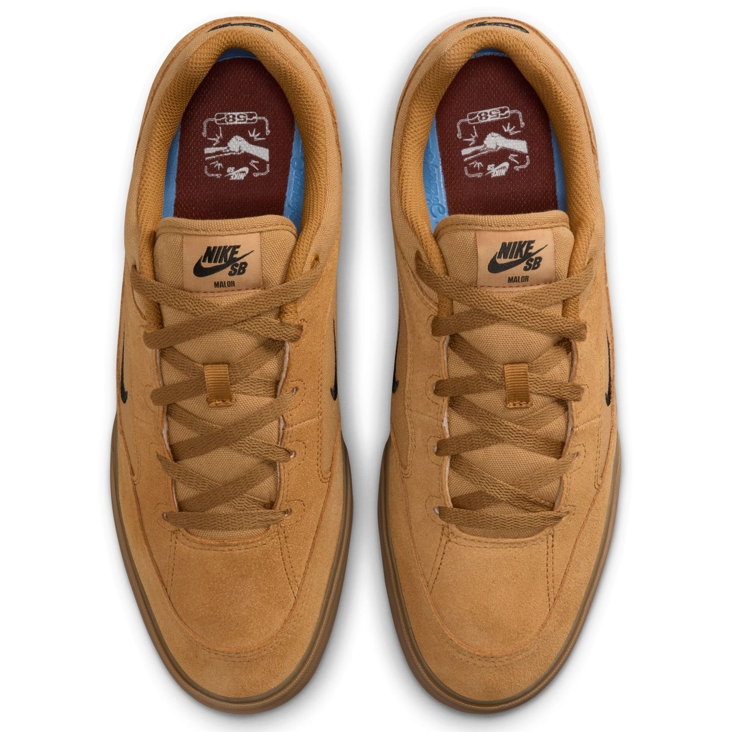 Pair of tan Nike SB sneakers on a white background