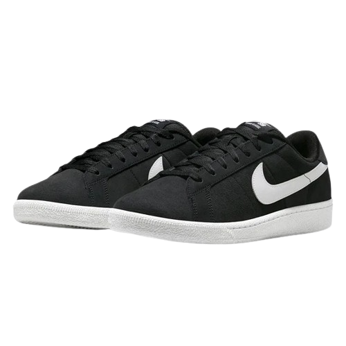 A pair of Nike low-top skate shoes in black with a prominent white Swoosh and white soles