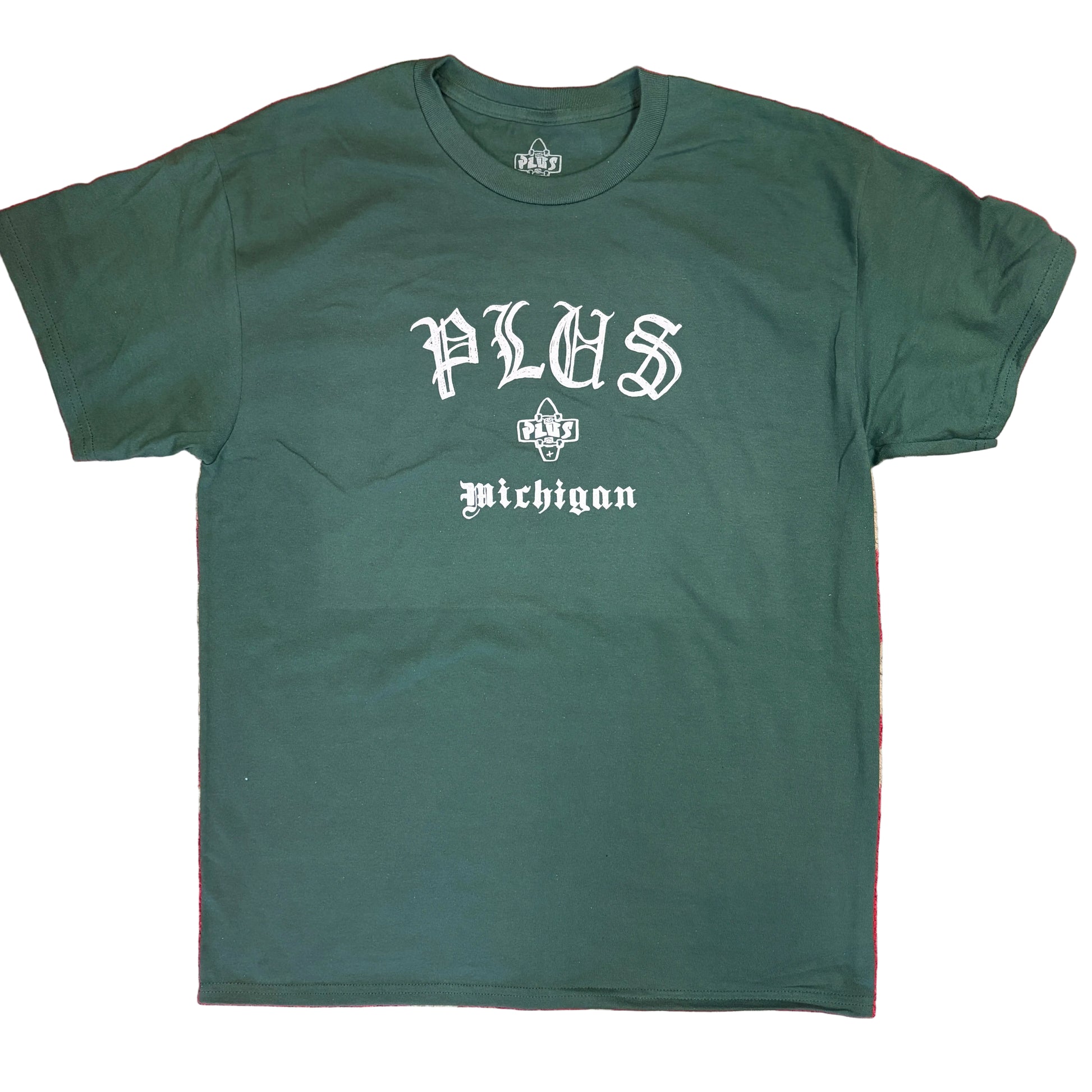 Green t-shirt with 'PLUS Michigan' text on a red and beige patterned background