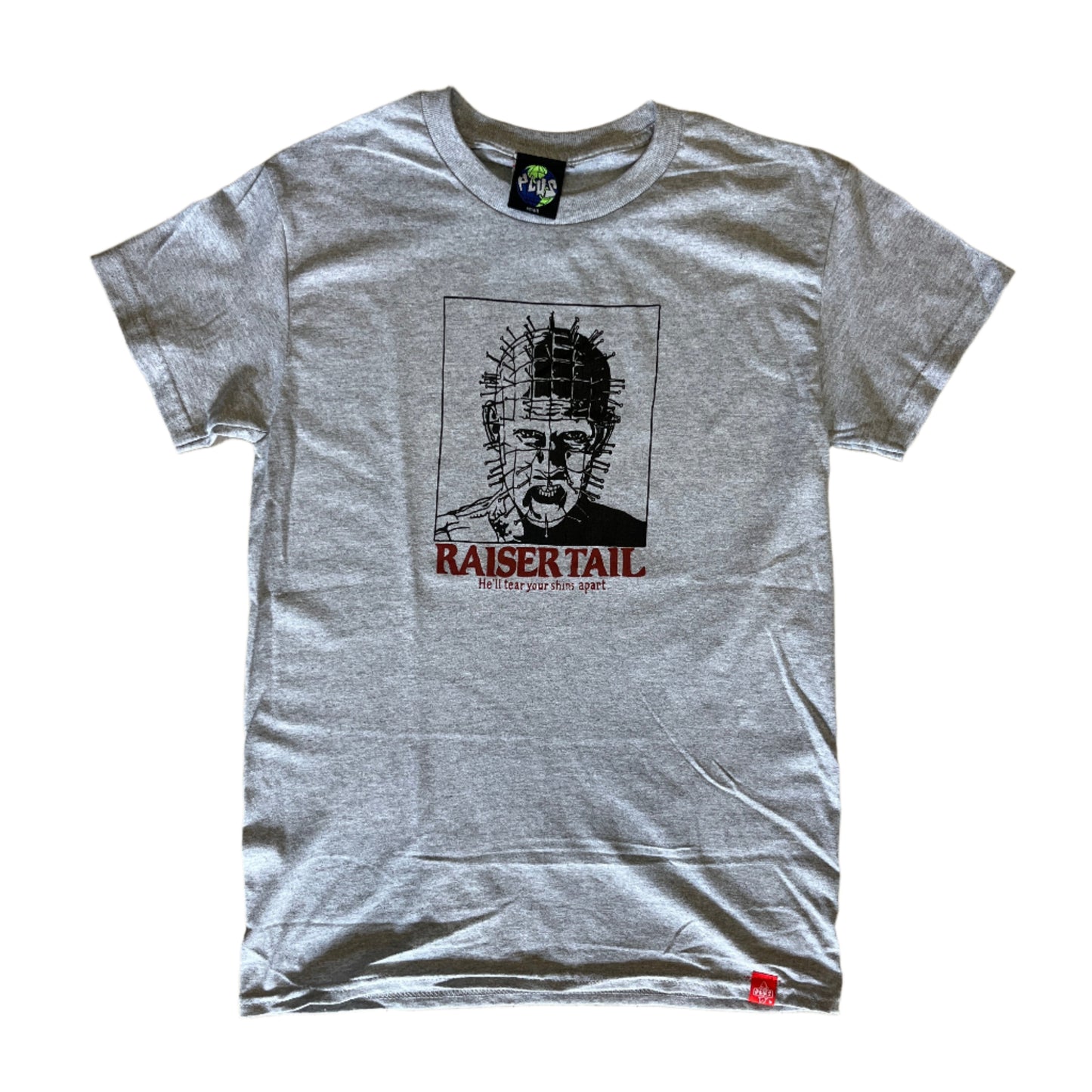 Gray t-shirt with graphic design on a wooden floor