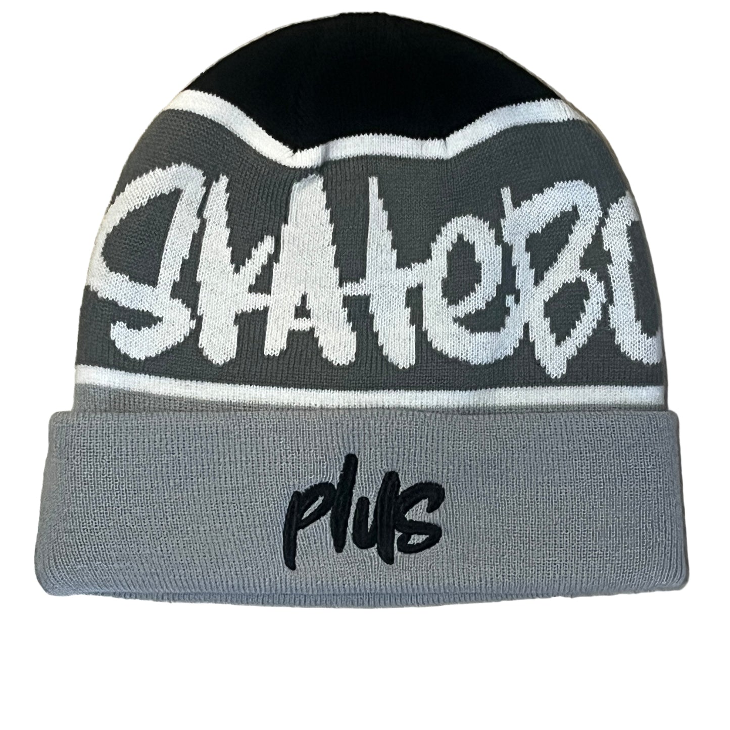 Gray and black beanie with text on a wooden floor
