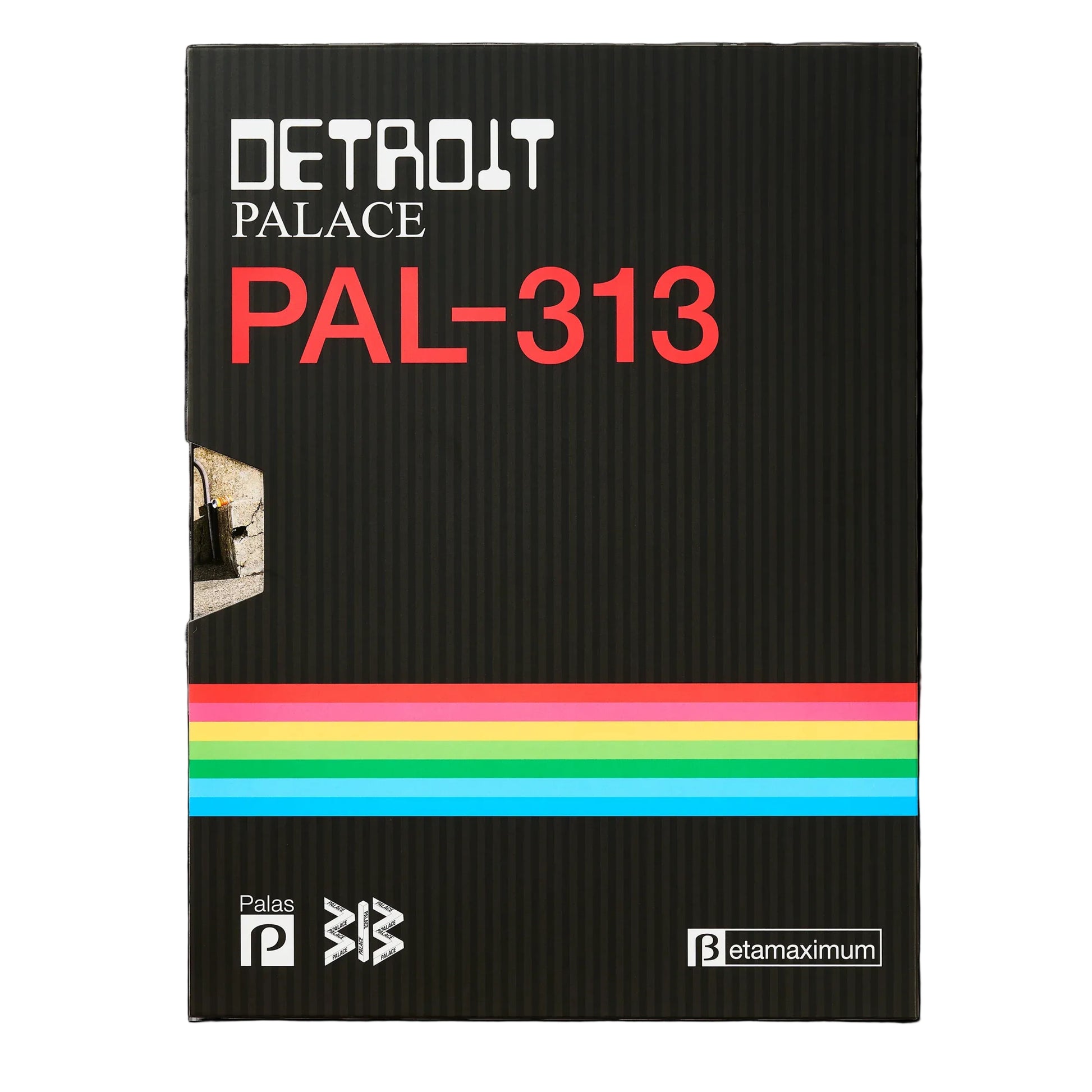 A black textured book or booklet cover titled 'DETROIT PALACE PAL-313' with bold red text and a horizontal rainbow stripe across the lower middle, shown on a white background.