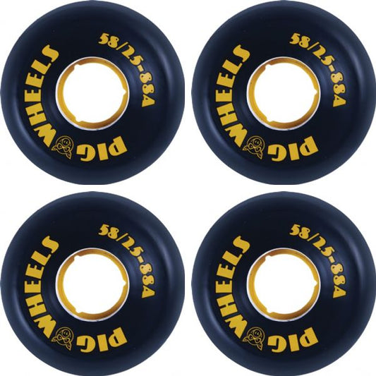 Four black pickleball wheels with yellow lettering and a yellow inner ring, arranged in a 2x2 grid on a white background. The brand name 'Pig Wheels' is clearly visible.