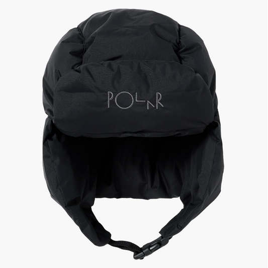 A black insulated winter helmet with ear flaps and a chin strap, featuring the POLR logo embroidered on the front, shown against a plain white background.